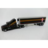 Franklin Mint - An unboxed American Kenworth semi truck in black,