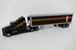 Franklin Mint - An unboxed American Kenworth semi truck in black,