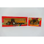 Britains - Two boxed 1:32 scale model vehicles appearing in Mint condition with Excellent boxes.