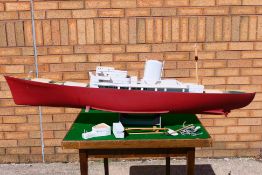 A part built model of a radio controlled model yacht.