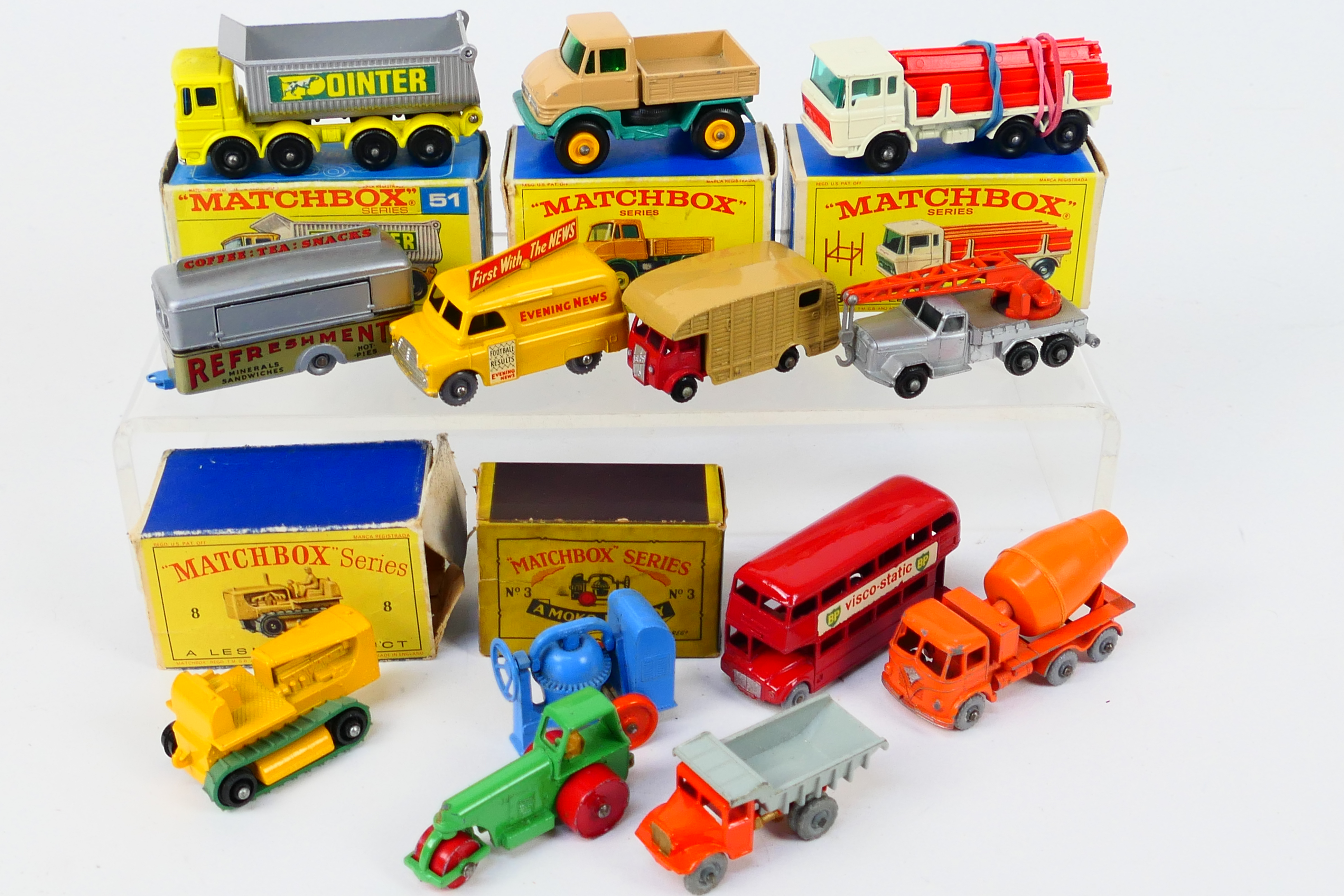 Matchbox - A group of models including AEC 8 Wheel Tipper # 51, Mercedes Unimog # 49,