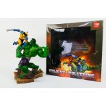 Tianbaotoys - Marvel - A boxed Hulk vs. Wolverine statue which is approximately 12 inches tall.