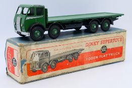 Dinky - A boxed Foden Flat Truck in the early colour scheme of green cab,