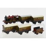 Bing - An unboxed clockwork OO gauge 2-4-0 steam locomotive and tender, with four unboxed carriages.