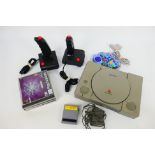 Sony - An unboxed Sony Playstation console with game enhancer, adapter,
