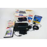 Sega - A boxed vintage Sega Master System II, which contains console, adapter, instruction manual,