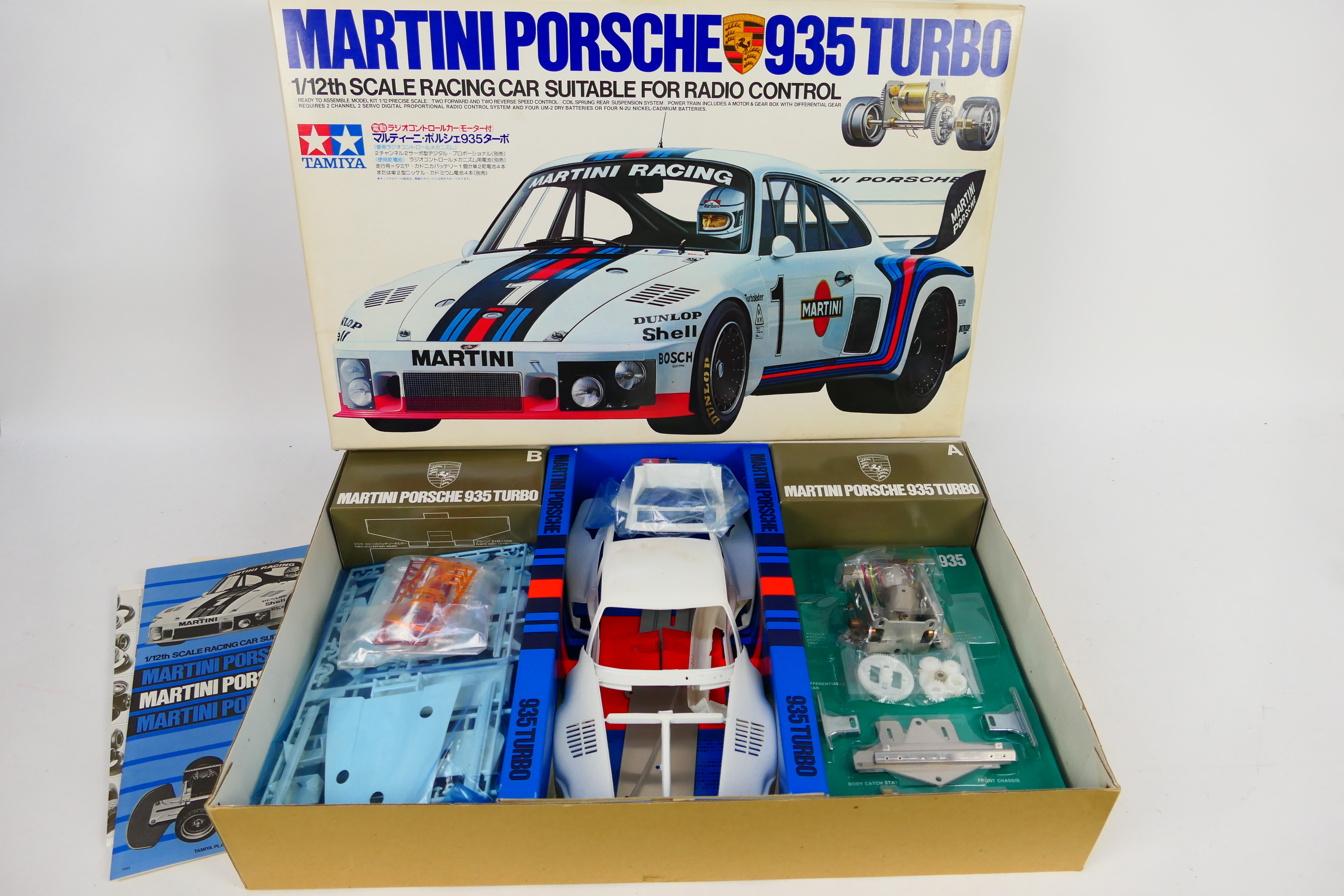 Tamiya - A boxed unmade motorised Porsche 935 Turbo model kit in 1:12 scale # RA1202.