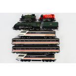 Hornby - A group of unboxed OO gauge locomotives and carriages.