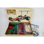 Tamiya - A boxed unmade Lotus 49B Ford F-1 model kit in 1:12 scale # BS1204. Released in 1968.