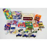 Corgi - Matchbox - Siku - Ertl - A group of boxed / carded models including Matchbox Wrangler