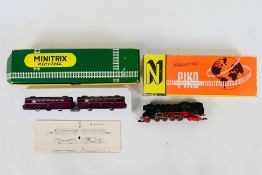 Piko - Minitrix - Two boxed N gauge locomotives.