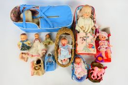 Blue Box - Other - A group of unboxed dolls carry cots / cradles and a group of mainly plastic