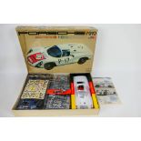 Tamiya - A boxed unmade Porsche Carrera 10 model kit in 1:12 scale # BS1203. Released in 1968.