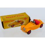 Dinky - A boxed MG Midget Sports in yellow touring finish # 102.