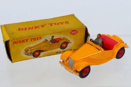 Dinky - A boxed MG Midget Sports in yellow touring finish # 102.