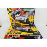 Scalextric - Two boxed Scalextric Bash'N Crash sets.