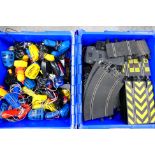 Scalextric - Two plastic containers one of which is packed with a large quantity of Scalextric