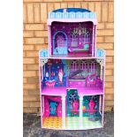 A Monster High dolls house measuring 118 x 62 x 29 cm with light up pillars.