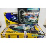 Scalextric - Two boxed Scalextric sets and a track accessory .