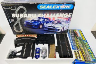 Scalextric - A boxed Scalextric Subaru Challenge' set and a Scalextric Track Extension Pack 2.