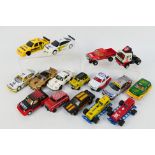 Scalextric - An unboxed group of 16 playworn Scalextric slot cars.