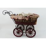 Unbranded - A vintage style dolls pram with a wicker body and metal frame measuring 70 cm including