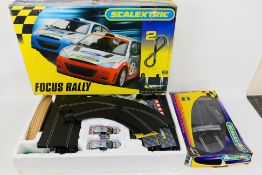 Scalextric - A boxed Scalextric 'Focus Rally' set and a Scalextric C8307 Race + Lap Counter Pack.