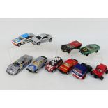 Scalextric - An unboxed group of 10 playworn Scalextric slot cars.