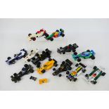 Scalextric - A collection of 14 unboxed playworn Scalextric Formula 1 / Formula 2 slot cars.