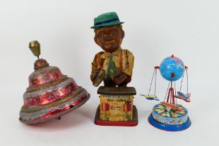 Rosko - DP - 3 x vintage tin toys, a spinning top marked D.P.