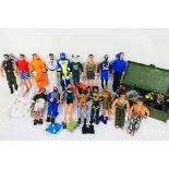 Action Man - A collection of Action Man figures with a trunk full of clothing and accessories.