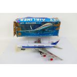 A boxed tin plate ME-087 battery operated aircraft model.