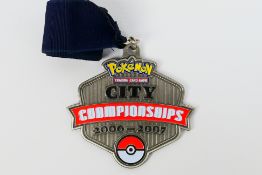 Pokemon - A 2007 Pokemon TCG United Kingdom National Championships City Champion medal and ribbon.