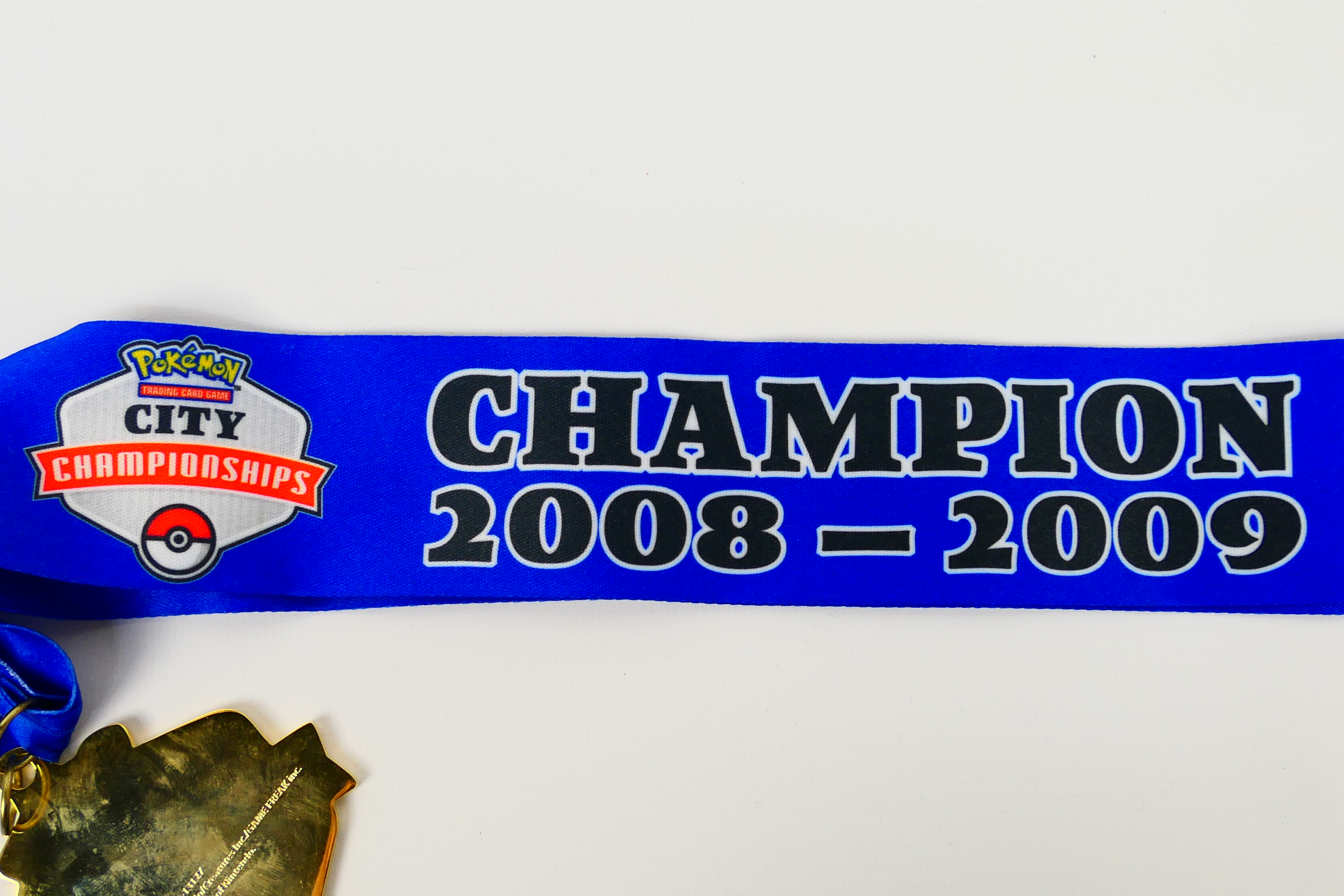 Pokemon - A 2009 Pokemon TCG United Kingdom National Championships City Champion medal and ribbon. - Image 4 of 4