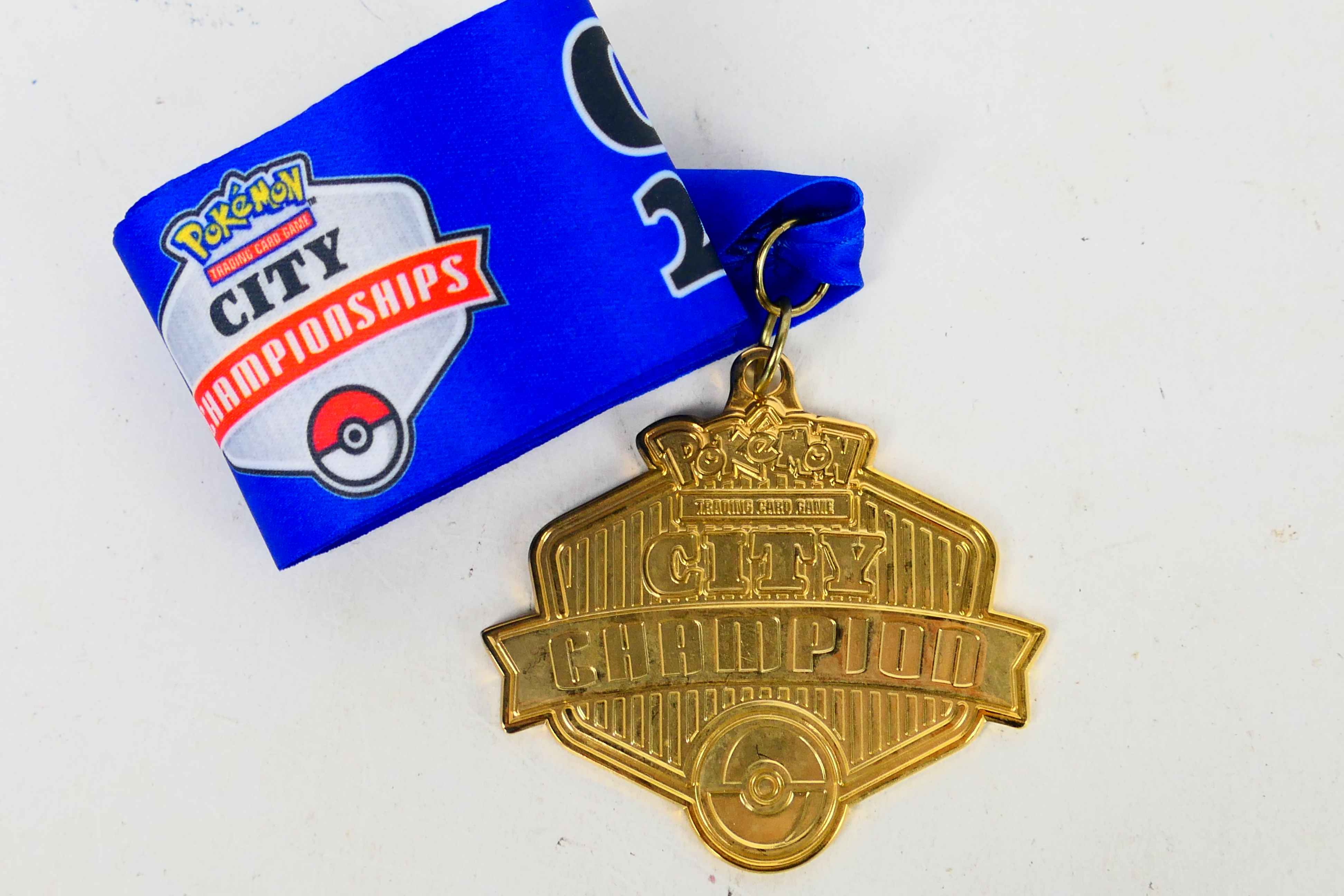 Pokemon - A 2009 Pokemon TCG United Kingdom National Championships City Champion medal and ribbon.