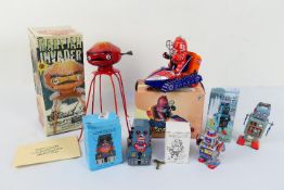 Tin Plate Wind up Robots - A selection of Five boxed tin plate wind up robots appearing in Mint