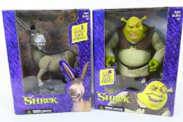 Shrek - McFarlane Toys. Two boxed 'Shrek' related action figures from McFarlane Toys.