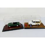 Minichamps - Corgi - Two unboxed 1:18 scale diecast model vehicles.