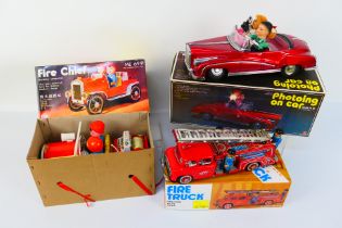 QSH - Vintage Tinplate - 3 x boxed vehicles, a battery operated Fire Chief car,