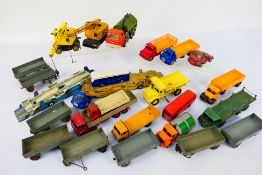 Dinky Toys - Corgi Toys - An unboxed group of playworn and mostly restored diecast model vehicles;