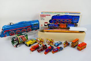 QSH - Yonezawa - Zimmerman - A collection of tinplate vehicles including a train set,