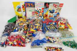 Lego - A large quantity of Lego pieces including a bag of early 1950s style bricks.