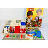 Lego - A boxed 1960s vintage #810 town Lego set - The set comes with flat card town layout for