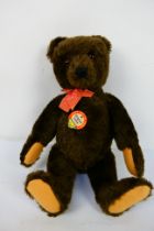 Steiff - An unboxed Steiff Original Marke, Original Teddy with faded red dicky bow in brown mohair.