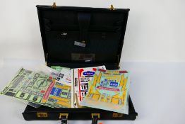 Tamiya - Kyosho - Other - Over 20 RC model decal sheets contained in a briefcase.