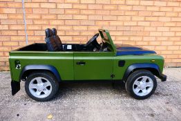 Land Rover - A children's battery powered 4 wheel drive Land Rover Defender.