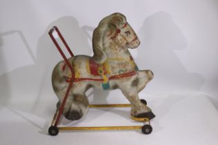 Mobo - A mid century Mobo child's push along tinplate horse.