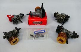 Kyosho - Magnum - Five mainly unboxed RC model car nitro engines with a bag of associated parts.