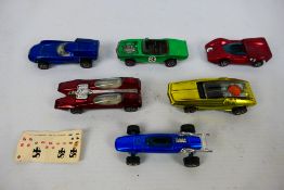 Hot Wheels - Redline - Mattel - A group of vintage Redline cars, the Indy Eagle with sticker sheet,