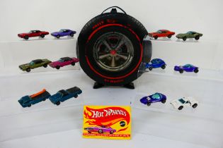 Hot Wheels - Redline - Mattel - A vintage wheel shaped carry case with 12 x Hong Kong made cars,